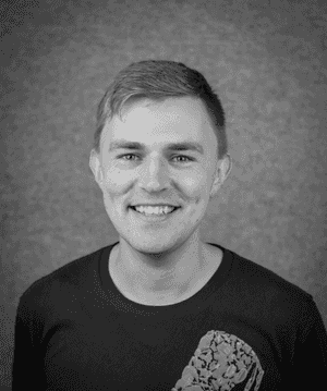 A black & white portrait of Stile team member Jeff Parsons smiling at the camera